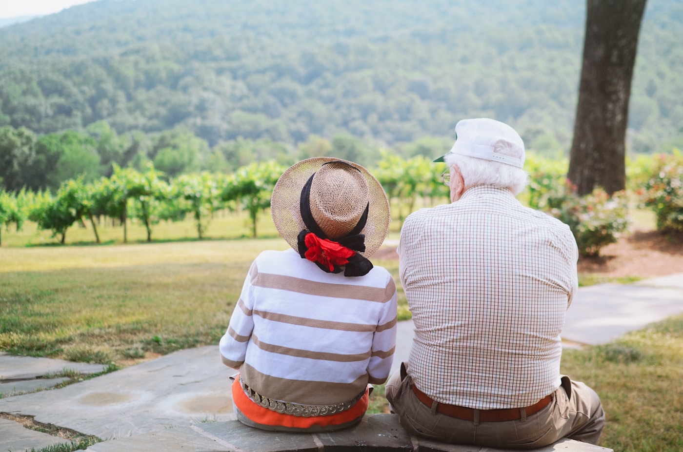 An older couple sitting together outdoors